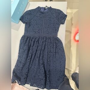 Bardot Junior. Size 16.
Navy blue lace dress with metal zipper in back.